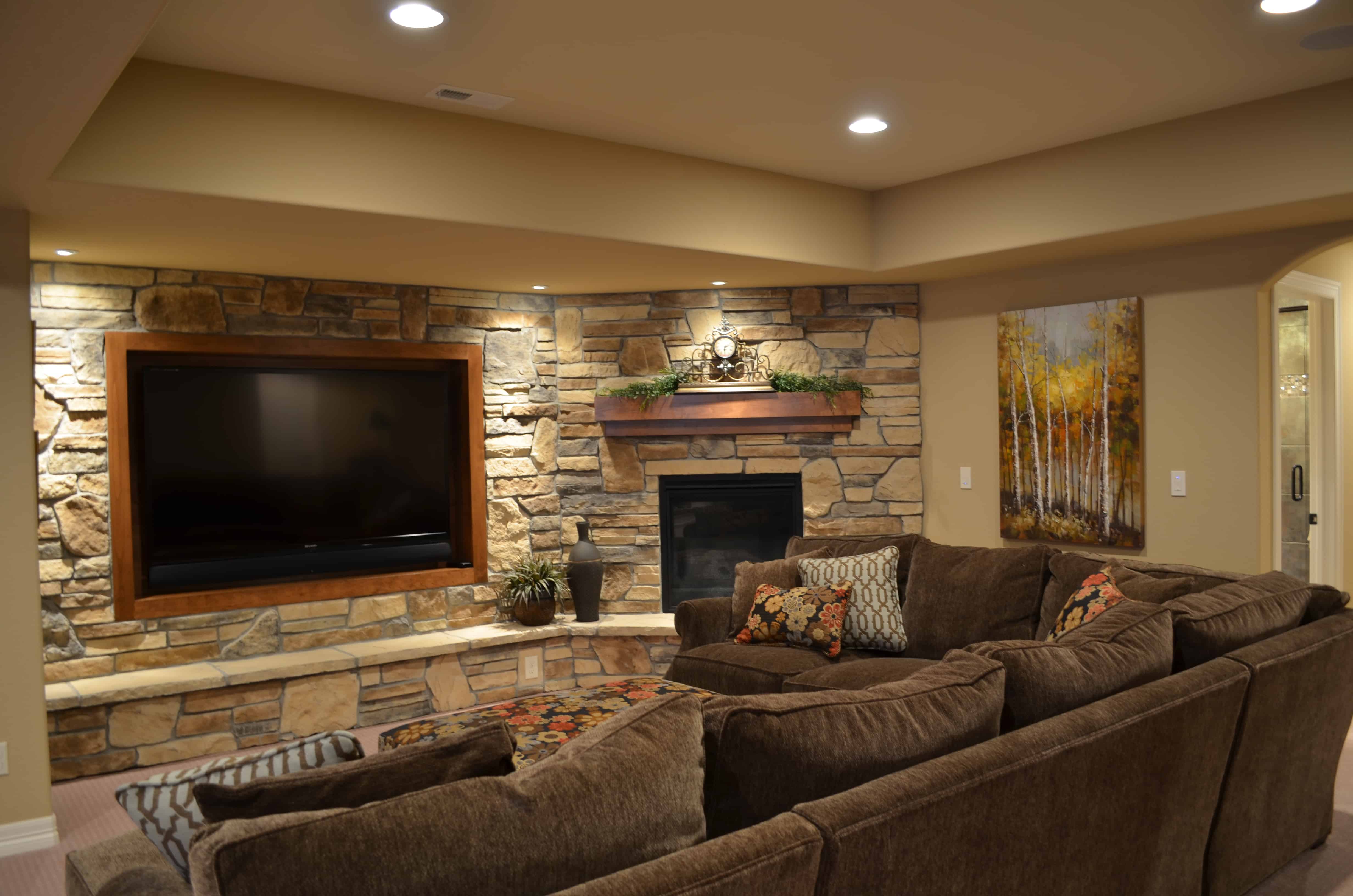 finished basement remodel with natural stone wall