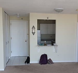 living room before removing popcorn ceiling