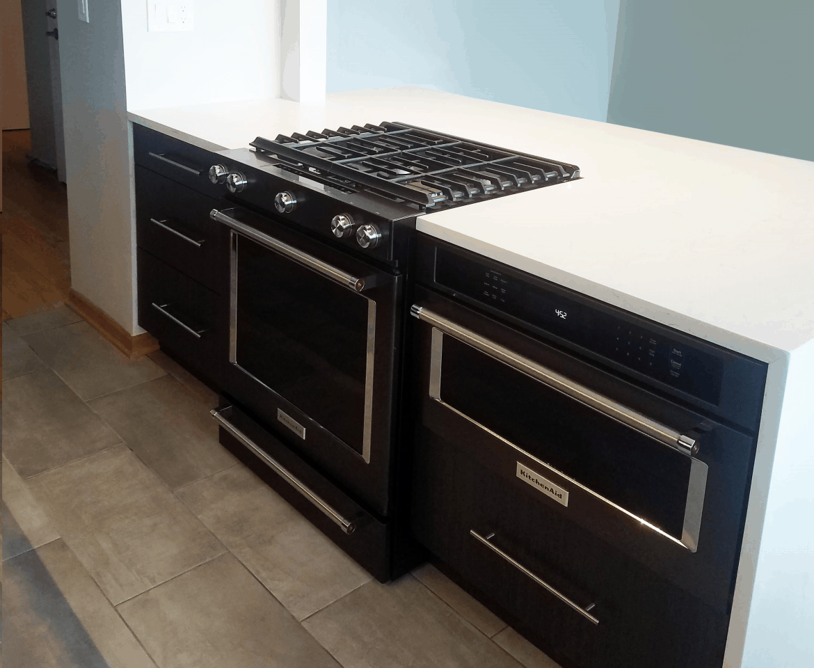 black kitchen cabinetry and appliances