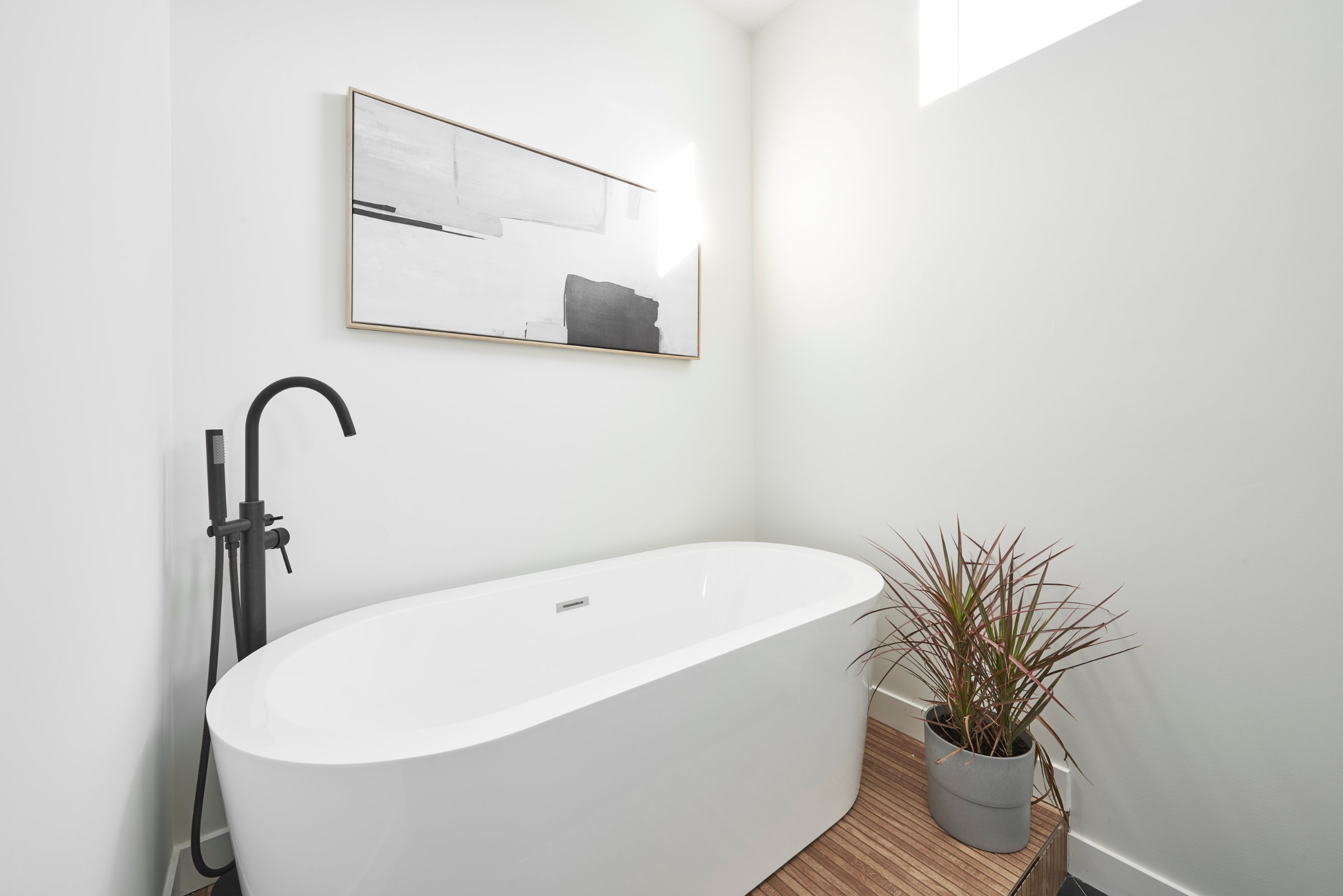 minimalistic bathroom remodel by 123 Remodeling freestanding tub close